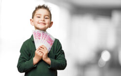 little kid holding banknotes